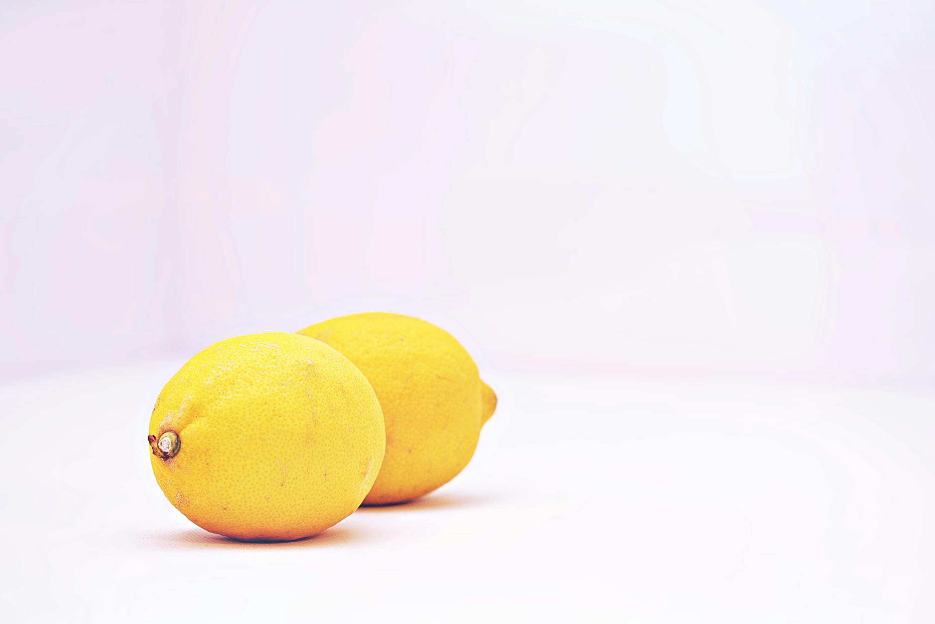 Fresh lemons on a white background, symbolizing recalibration and renewal