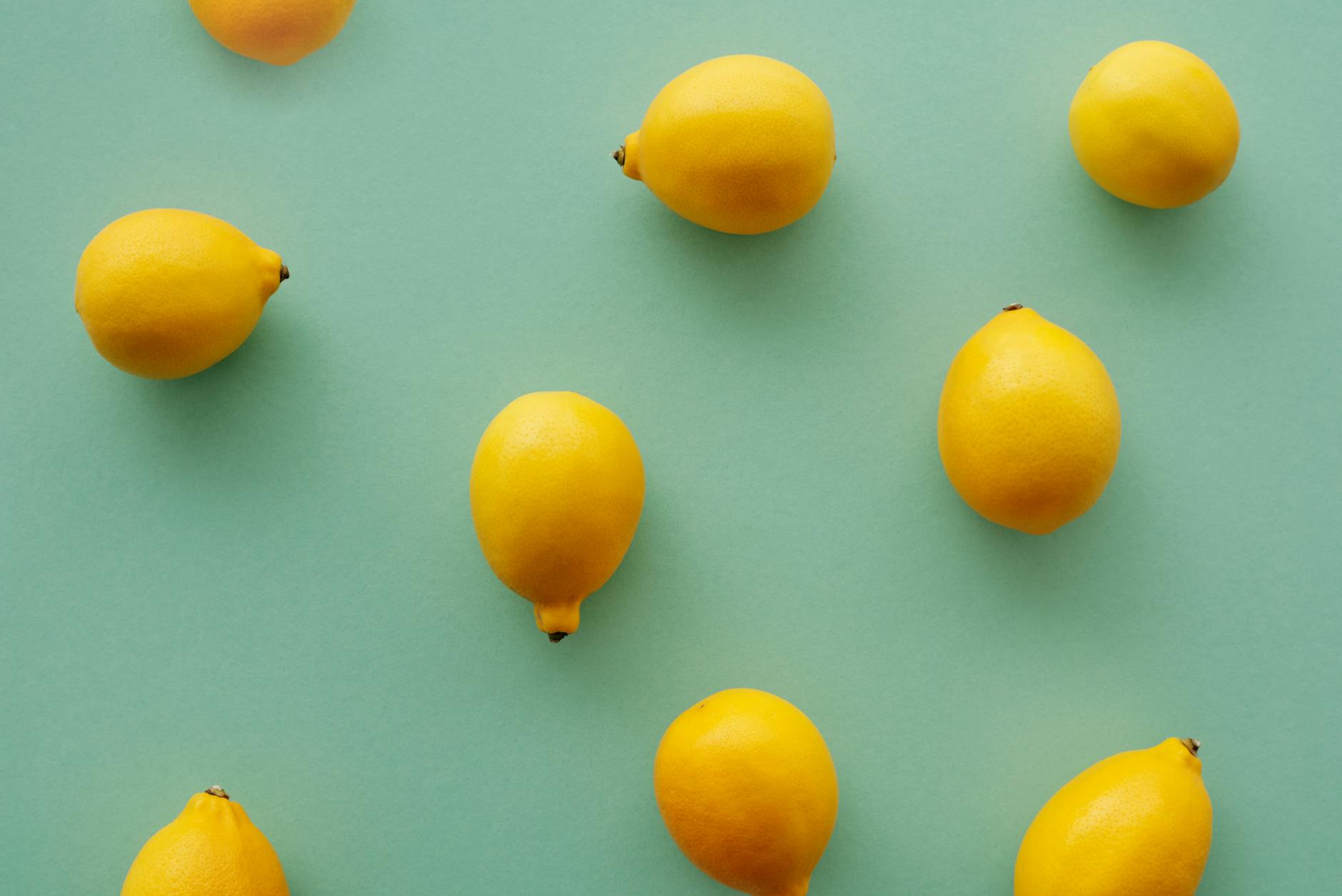 Two women laughing together with lemon slices, representing joy and openness in intimate partnership